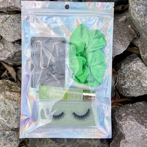 Green pack with lipgloss bracelet lashes scrunchie